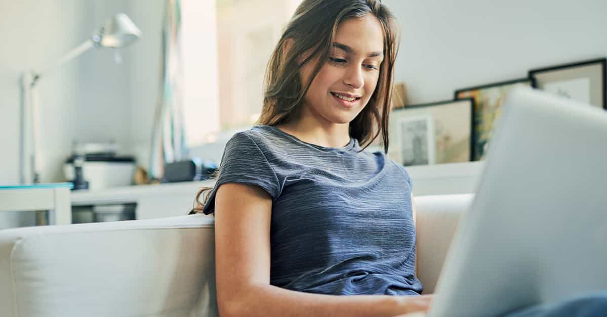 Student engaging in virtual learning on a laptop